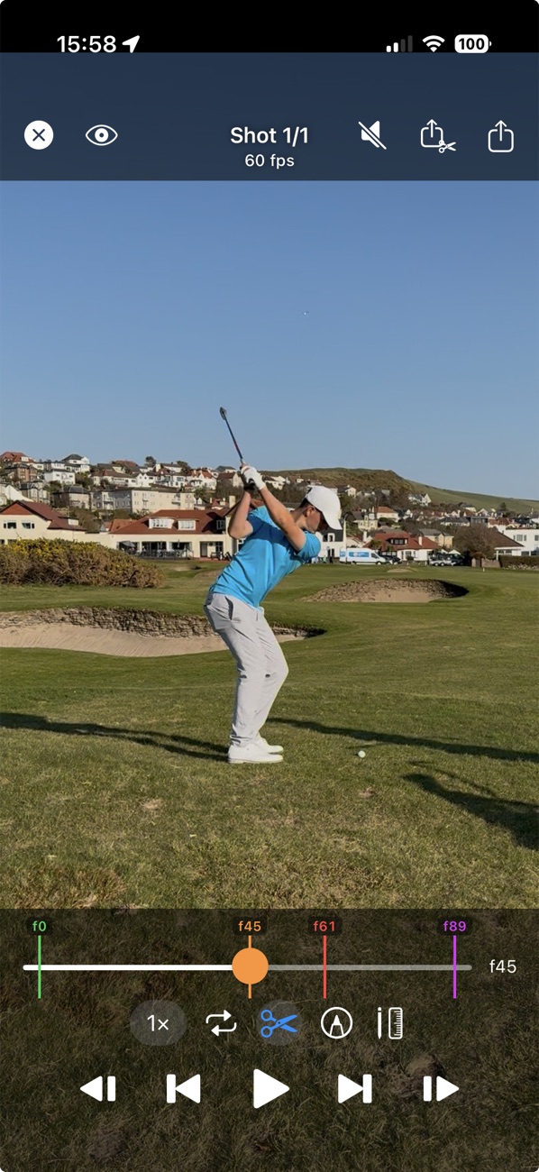 TrajectoryX swing video: a golfer at the top of the backswing with the swing points detected on the timeline