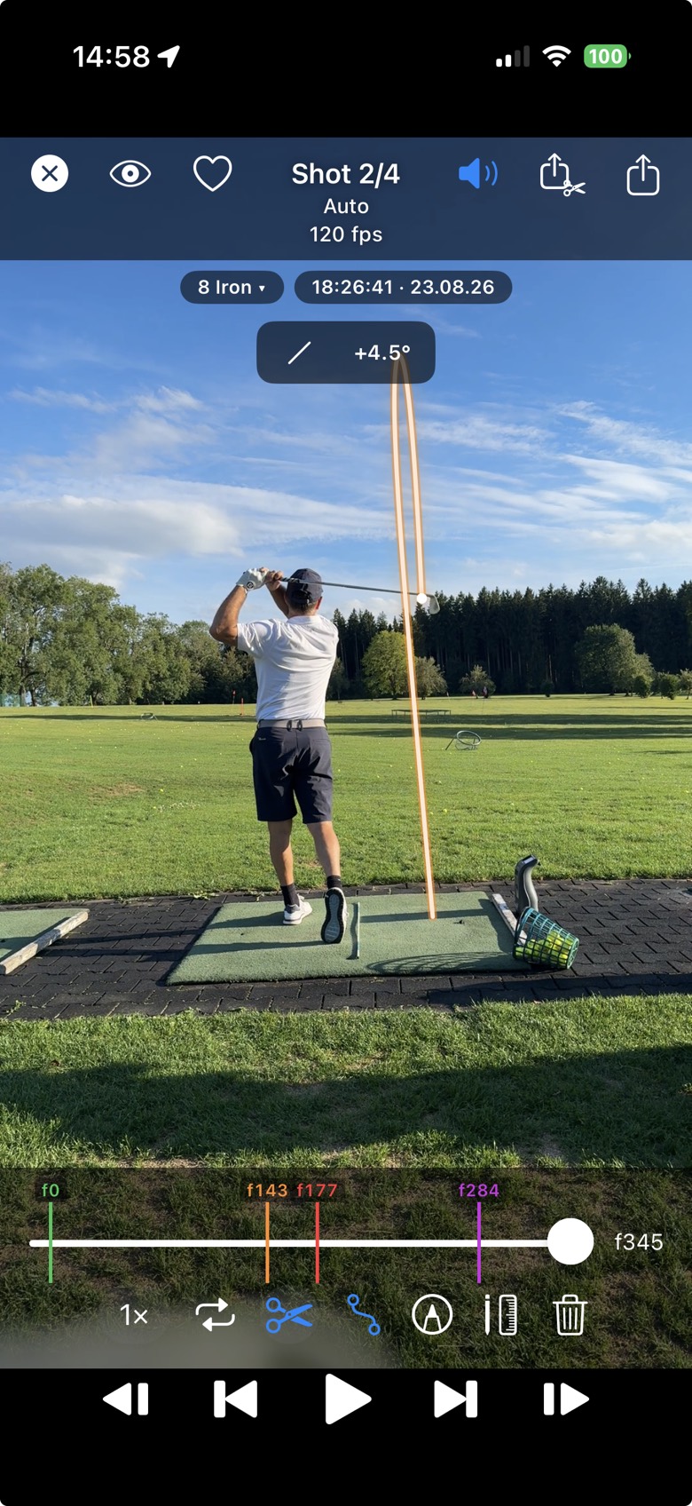 TrajectoryX swing video with the ball tracer: the computed ball flight drawn over an 8 iron swing at the driving range, with the swing points on the timeline below